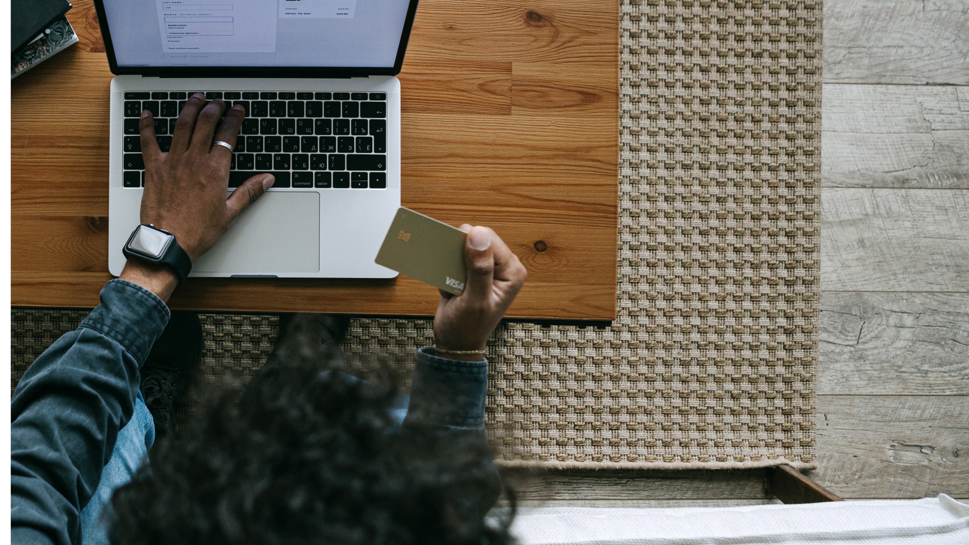 A business owner reviewing numbers on a laptop