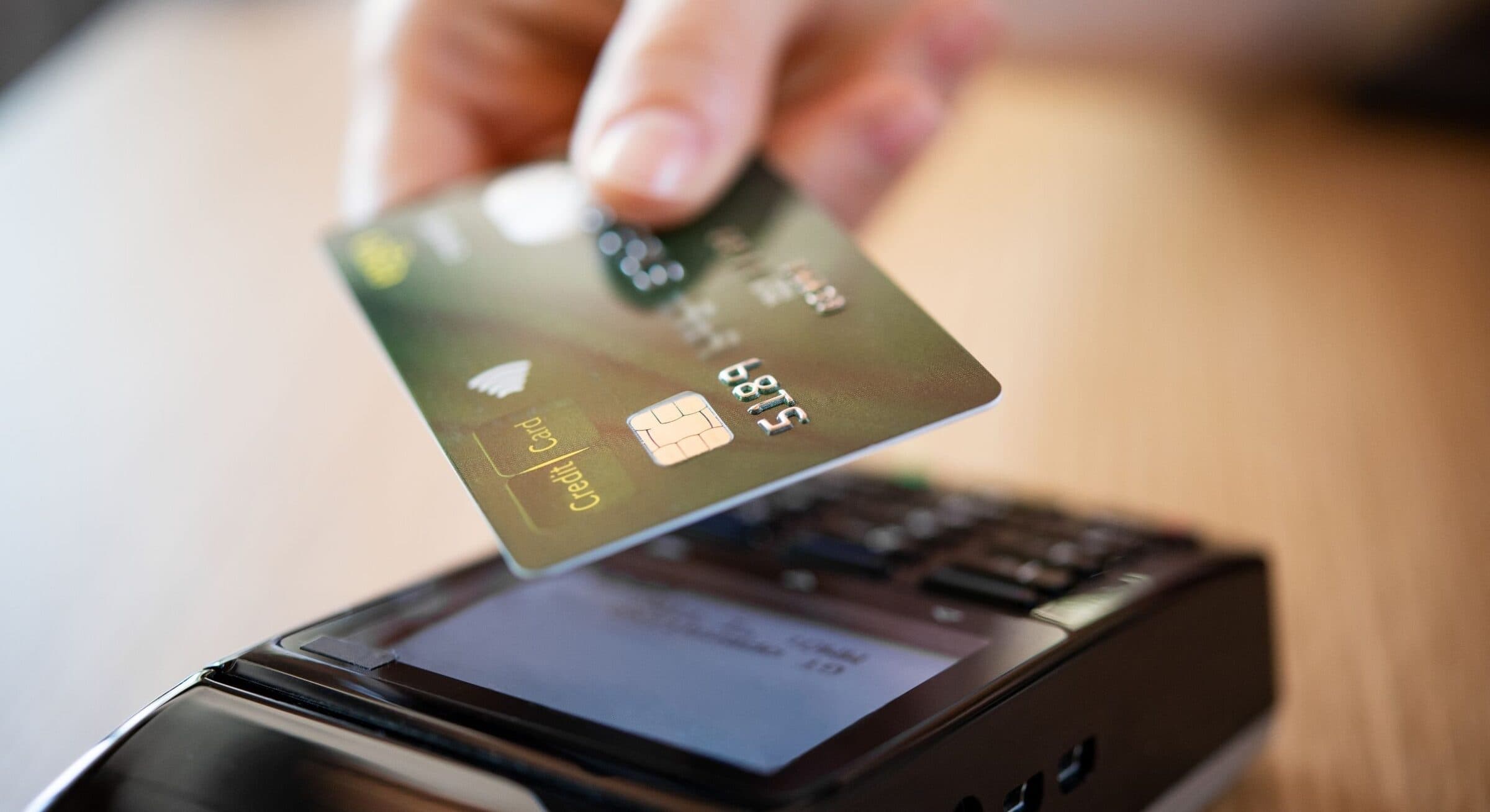 Customer tapping a card on a payment terminal